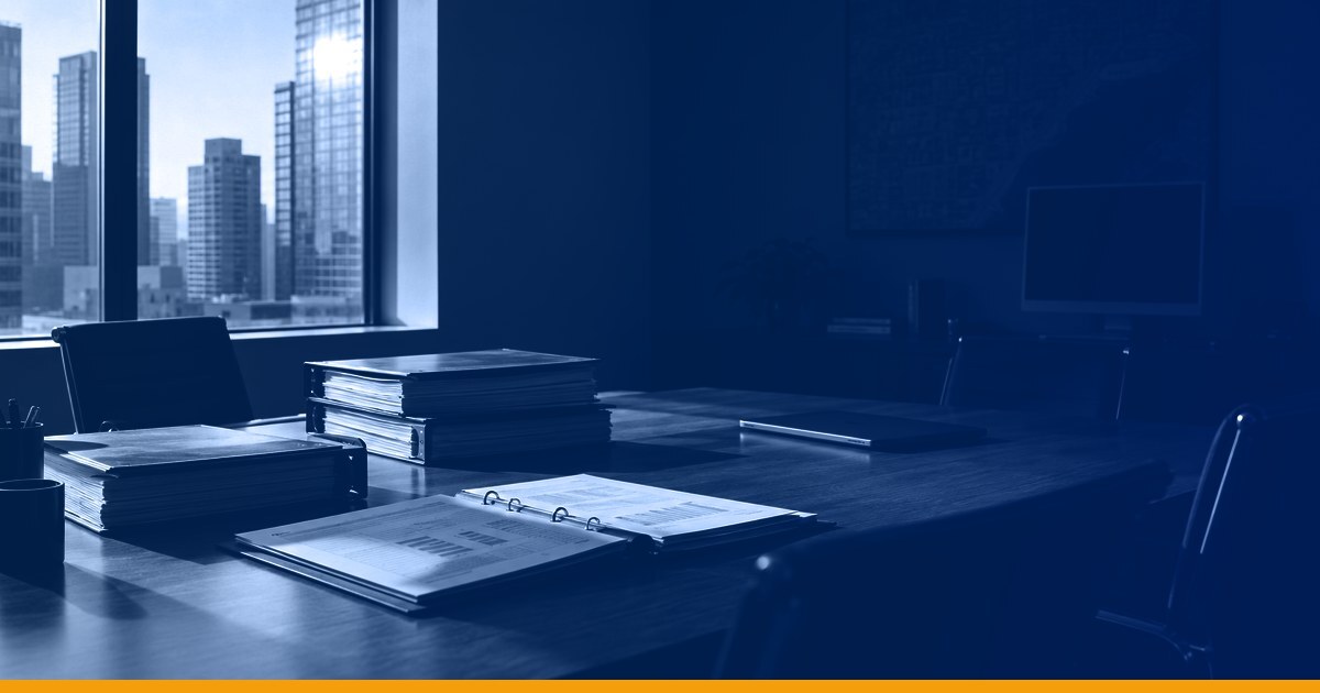 A conference table in a commercial real estate office with printed budget binders lit from a tall window, under a Kardin navy gradient overlay.
