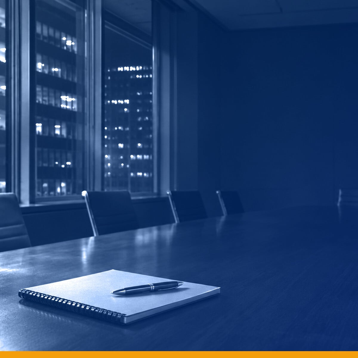 An empty boardroom at night, a notebook and pen on a conference table under a Kardin navy gradient overlay.